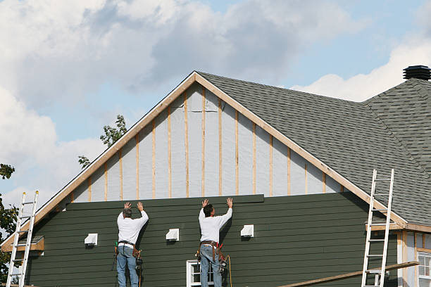 Professional Siding Installation technician working in Evans, CO